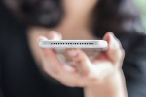 Speaker on mobile smartphone device and port for voice identity recognition in digital smart technology